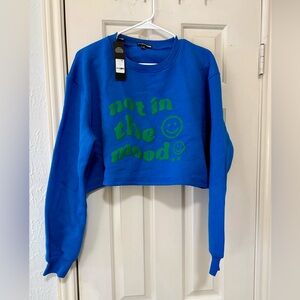 Fashion Nova Blue Sweater with Green Text